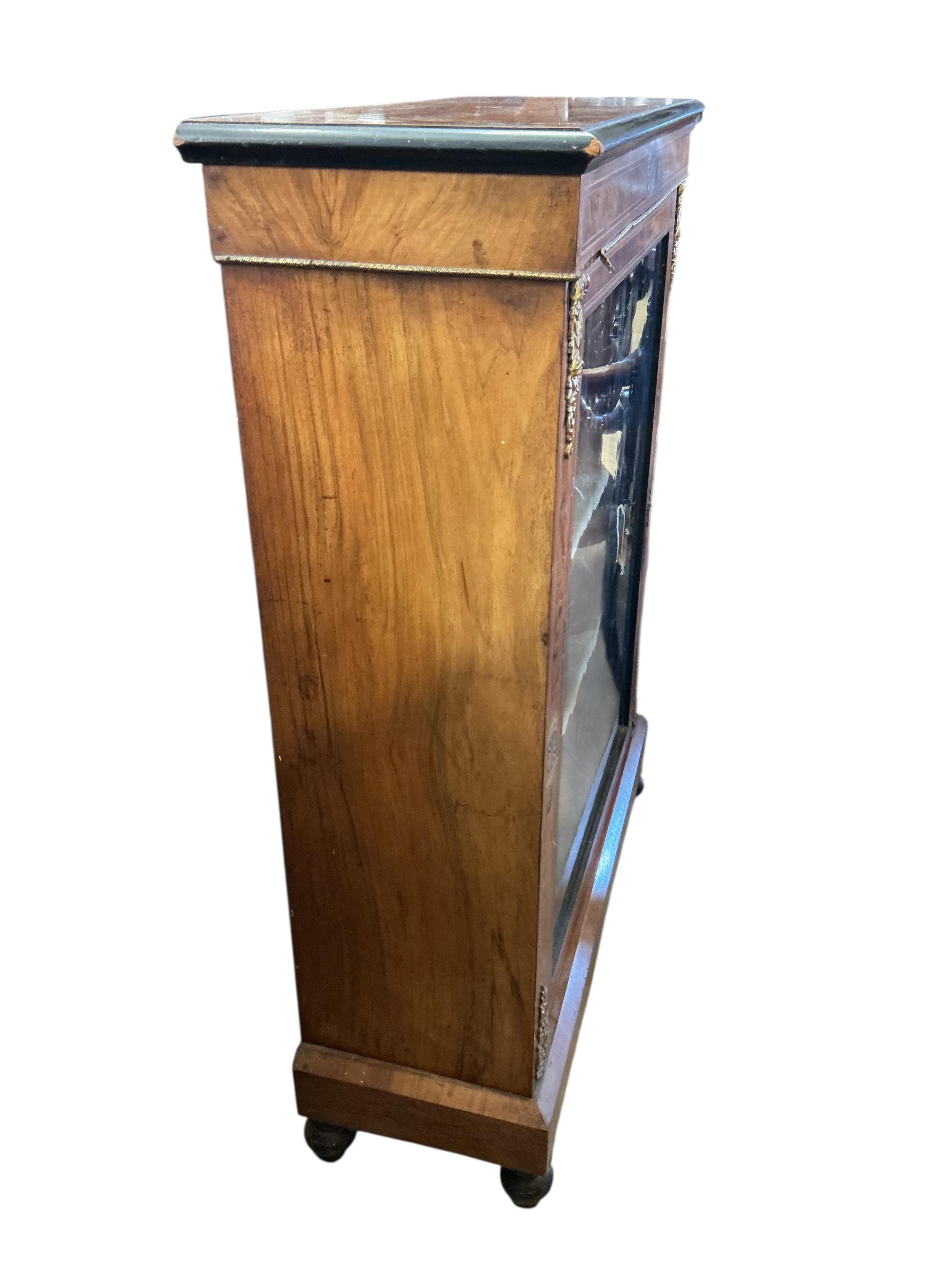 A late Victorian gilt metal mounted inlaid walnut pier cabinet, width 79cm, depth 29cm, height 106cm